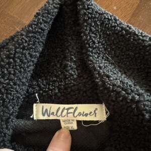 WallFlower Women's Black Sherpa Fleece Mock Neck Pullover with Zip Chest Pocket